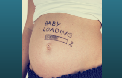Pregnant tummy with 'baby loading' written on it