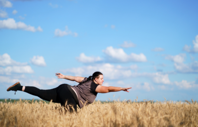 Woman dancing in a wheat field