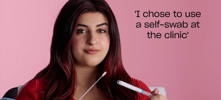 Woman holding a self-swab 